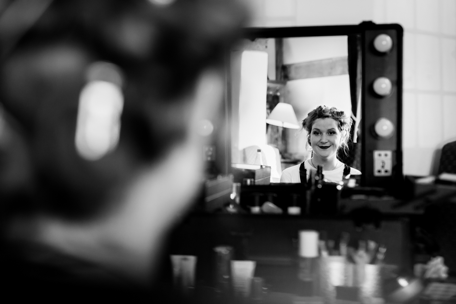 Saxon Mill Wedding Photographer - black and white photo of bride looking in the mirror