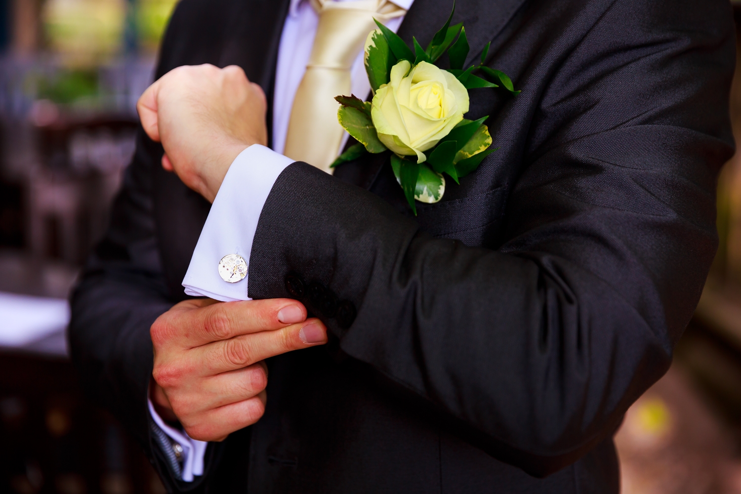 Saxon Mill Wedding Photographer - groom doing his cufflinks