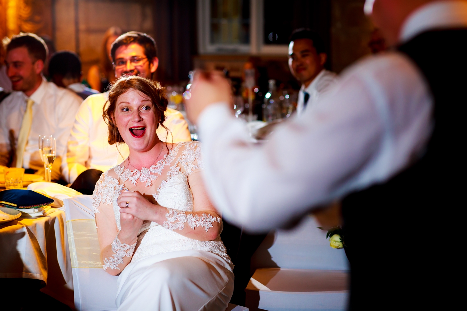 Saxon Mill Wedding Photographer - bride laughing at grooms speech