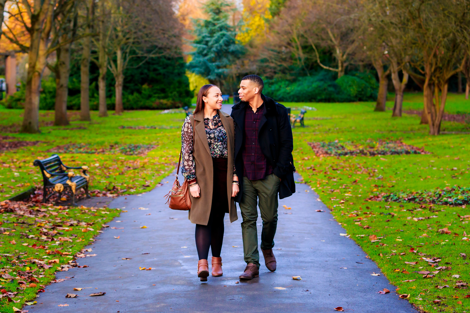 Couple walking hand in hand in Brueton Park during their engagement shoot