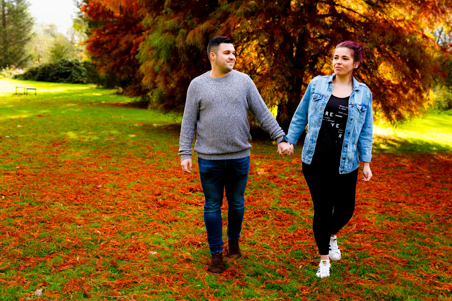 Couple holding hands in Brueton Park on their engagement shoot
