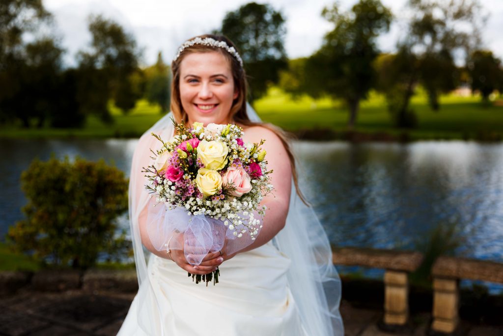 Horsley lodge wedding photography - bridge with bouquet