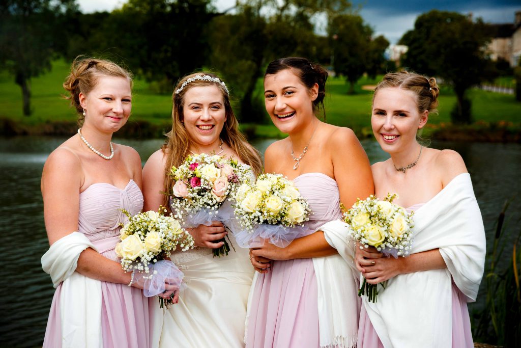 Horsley lodge wedding photography - brides maids outside horsley lodge lake