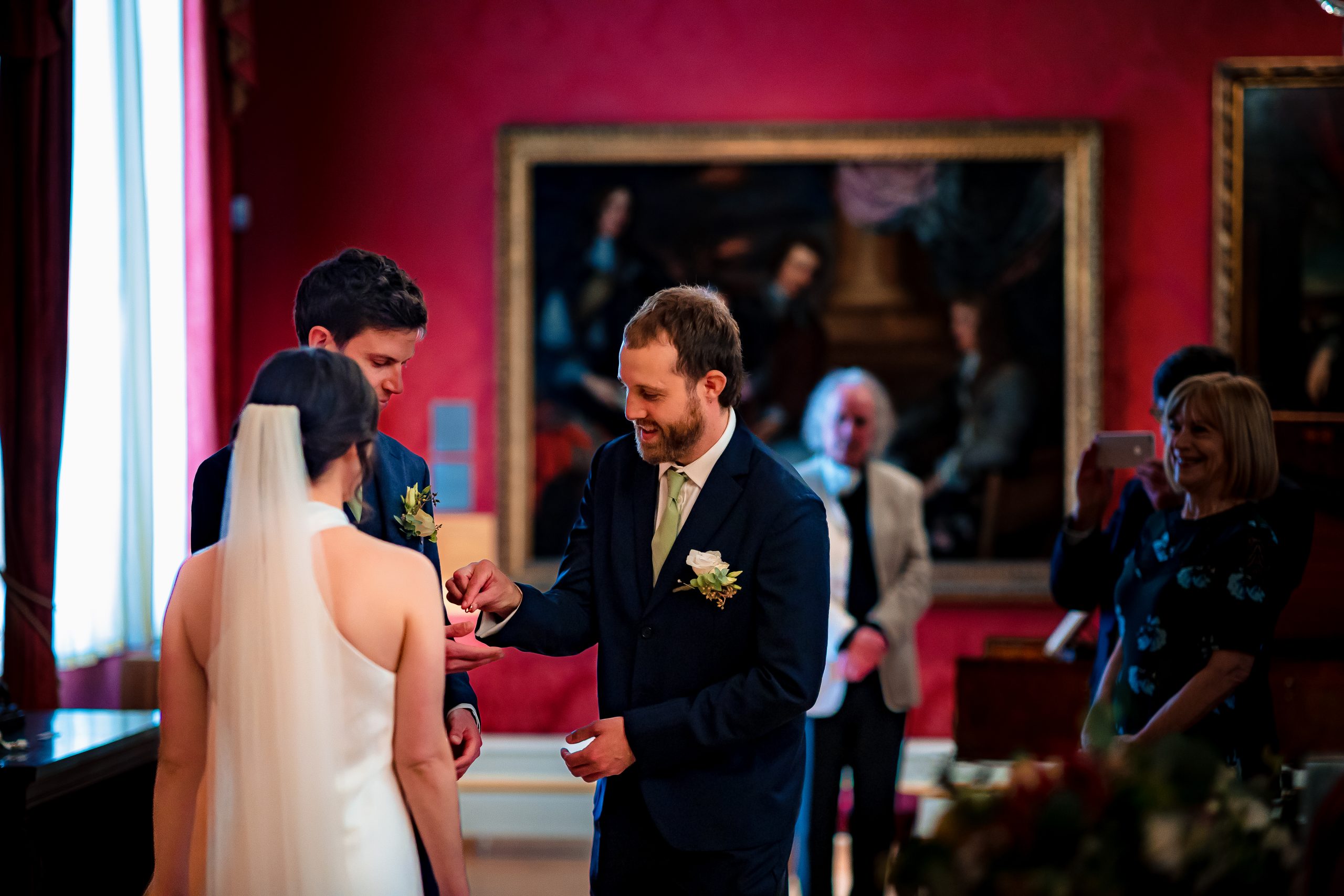 Ashmolean Wedding Photography 115 Best man handing groom the ring