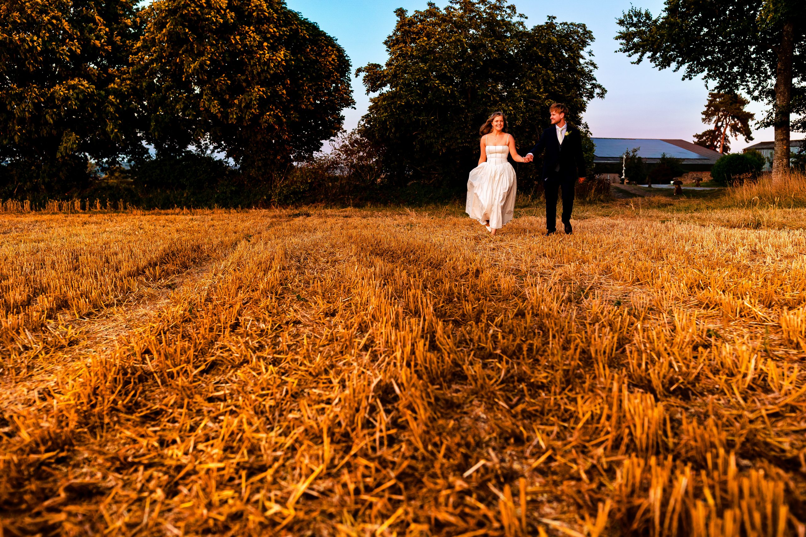 0W1A4342 Bride looking lovingly into her grooms eyes whilst saying her vows at Hadsham Farm